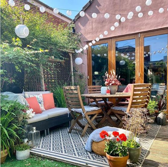 A busy patio with a round table in the middle