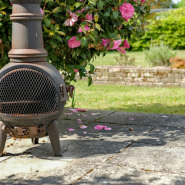 garden heating ideas with a traditional chiminea on a patio